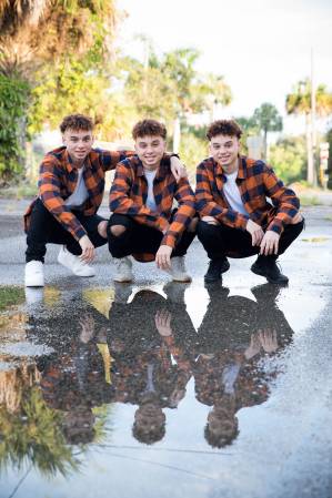 Identical Triplets Stay Grounded While Influence Goes Viral
